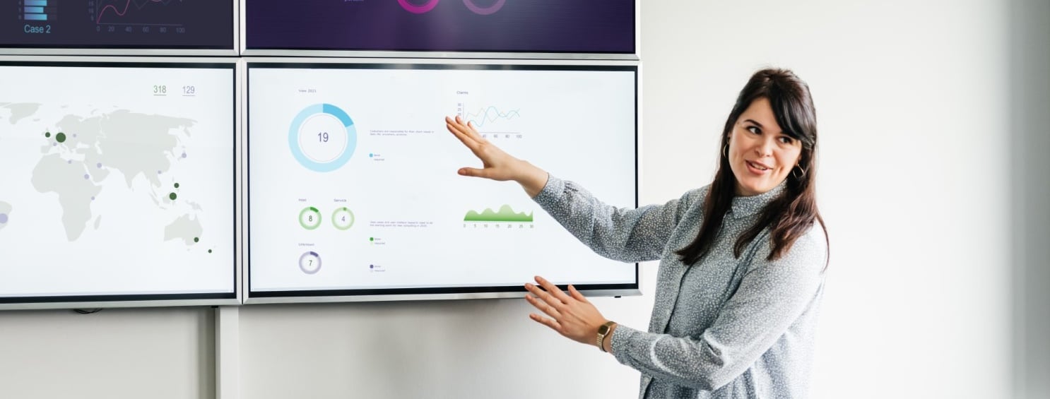 woman presenting business data reporting Cropped.jpg